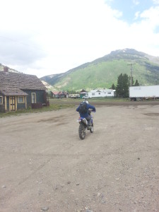 Andrew on the dirt bike from Silverton to kilpacker trail head over ophir pass to the Wilson group